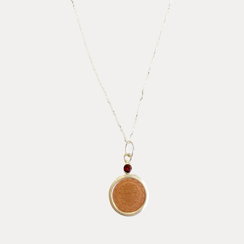 Sterling Silver Sri Yantra Pendant mounted in faceted garnet in 18" chain